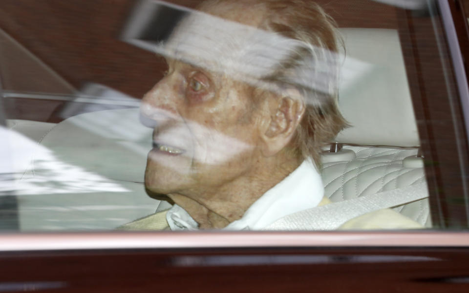 Britain\'s Prince Philip leaves the King Edward VII hospital in the back of a car in London, Tuesday, March 16, 2021. The 99-year-old husband of Queen Elizabeth II has been hospitalized after a heart procedure. (AP Photo/Alastair Grant)