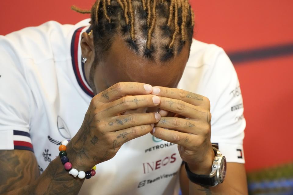 Mercedes driver Lewis Hamilton of Britain gestures as he attends a news conference at the Baku circuit, in Baku, Azerbaijan, Friday, June 10, 2022. The Formula One Grand Prix will be held on Sunday. (AP Photo/Sergei Grits)