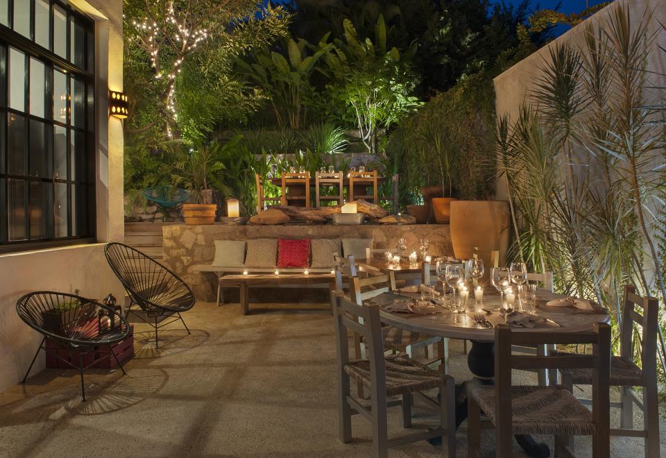 The romantic courtyard at Pueblo 25 sparkles with candlelight after dark.