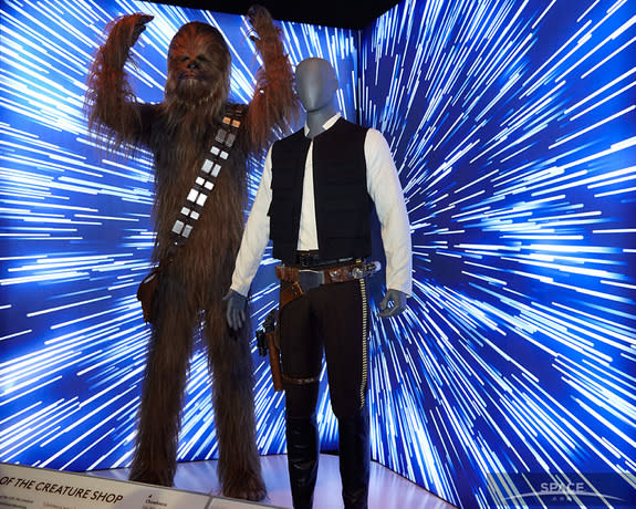 Costumes worn by Peter Mayhew (Chewbacca) and Harrison Ford (Han Solo) in the original "Star Wars" trilogy, are part of a new exhibit in Times Square.