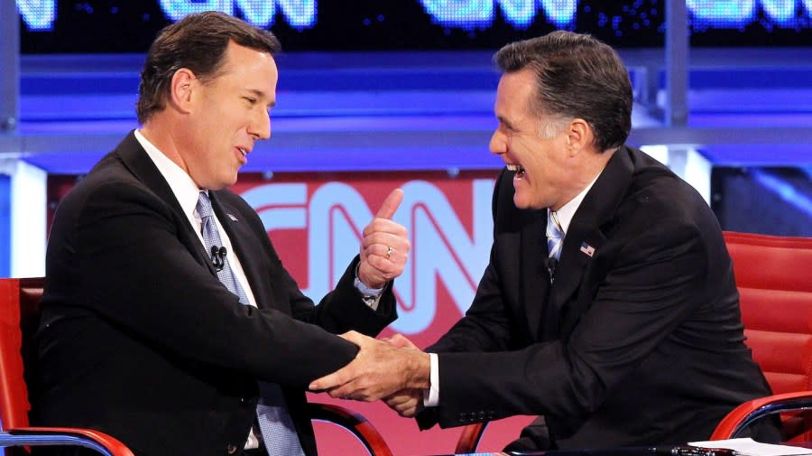 <em>Rick Santorum and Mitt Romney talk after participating in a debate sponsored by CNN and the Republican Party of Arizona at the Mesa Arts Center on Feb. 22, 2012, in Mesa, Ariz.</em> (Photo by Justin Sullivan/Getty Images)