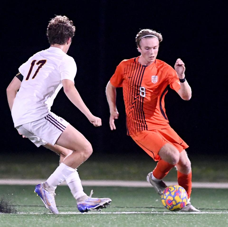 Hoover midfielder Cam VanNatta passes the ball in the first half against Walsh Jesuit at Hoover. Thursday, Sept 21, 2023.
