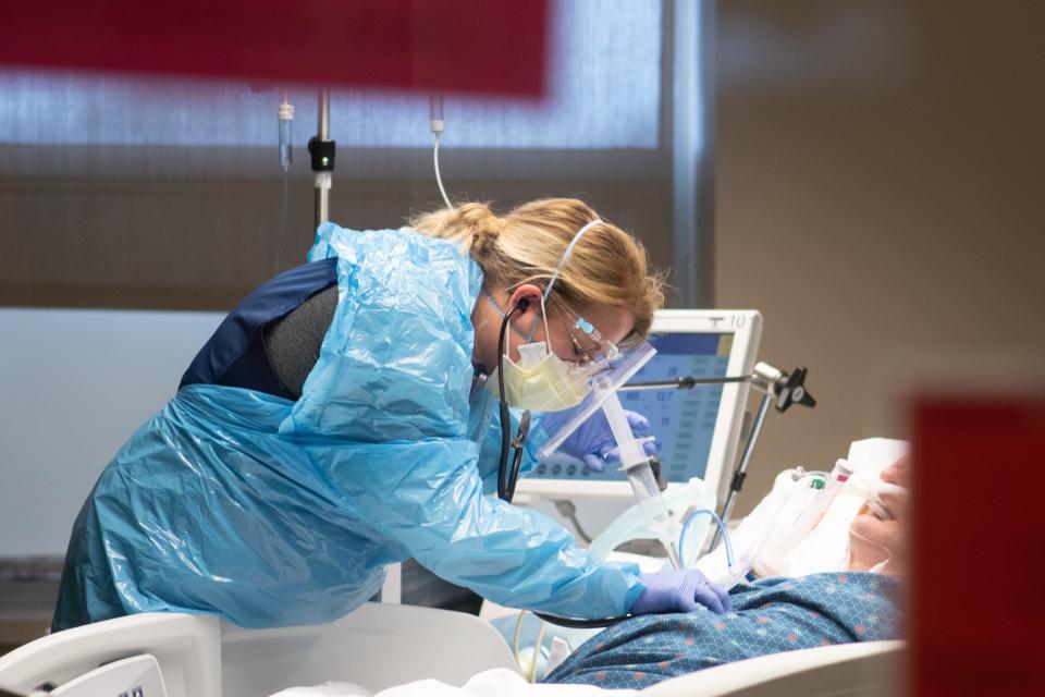 Inside the COVID-19 intensive care unit at Stormont Vail Health, patients are seen in and out of consciousness in varying levels of condition. Health officials are predicting a "rough couple weeks" as COVID cases surge in Kansas.