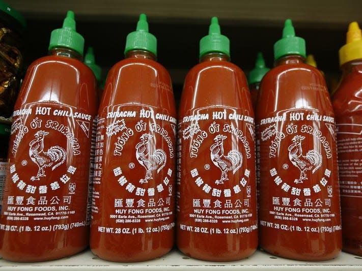 Bottles of Sriracha hot chili sauce, made by Huy Fong Foods, are seen on a supermarket shelf in San Gabriel, California October 30, 2013. REUTERS/Lucy Nicholson