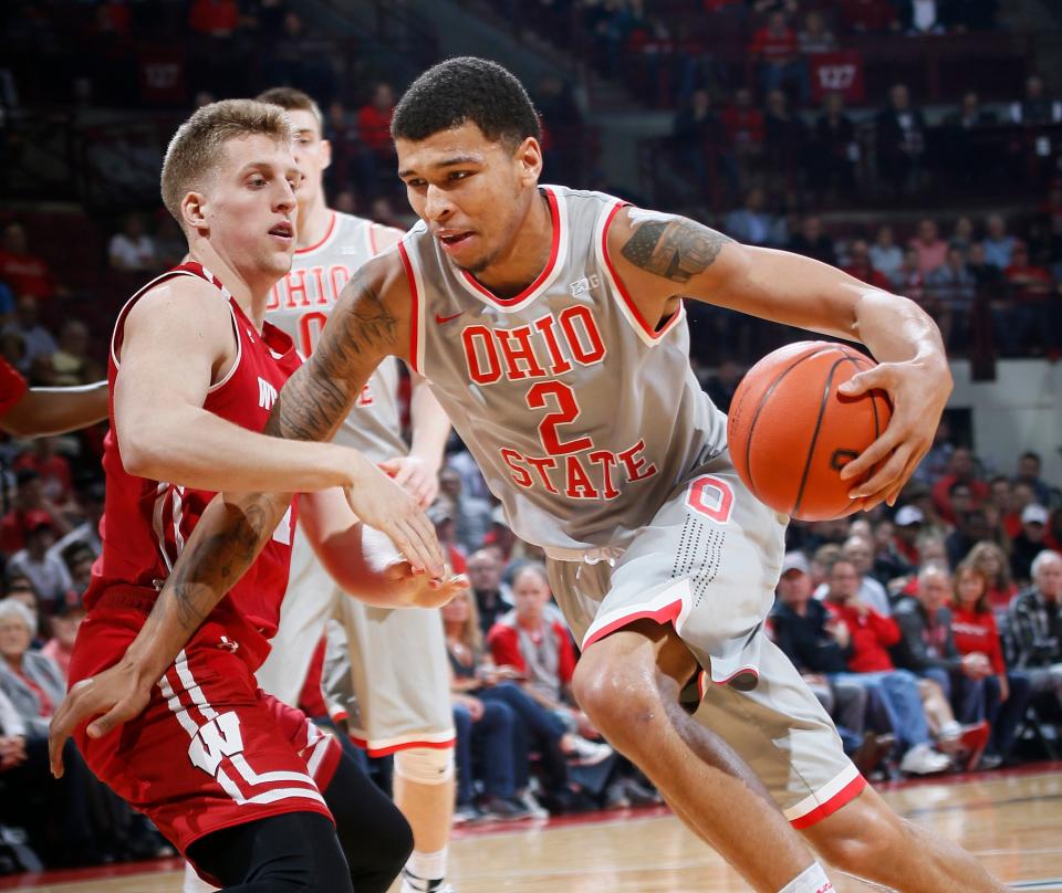 Ohio State Buckeyes forward Marc Loving (2) drives around Wisconsin Badgers guard Brevin Pritzl (1) during the first half of the NCAA mens basketball game at Value City Arena in Columbus on Feb. 23, 2017. [Adam Cairns/Dispatch]