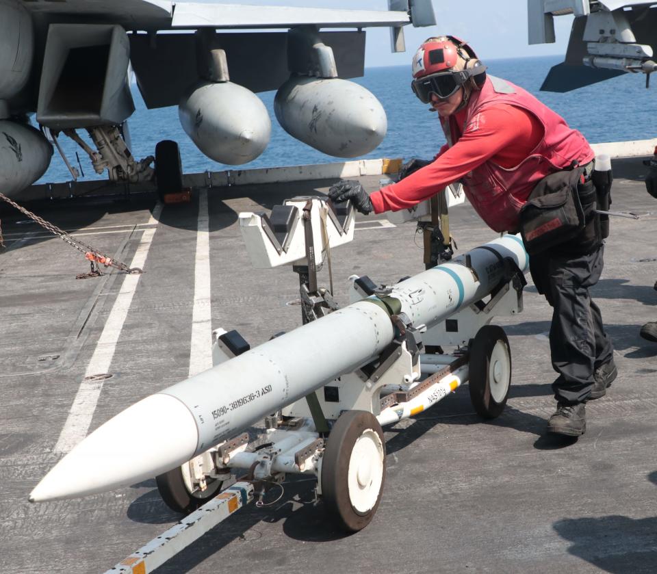 A crew member on the Navy's USS Dwight D. Eisenhower, a nuclear-powered aircraft carrier, in the Atlantic Ocean, Friday, June 30, 2023. News-Journal photographer Nadia Zomorodian recently spent 24 hours on the ship.