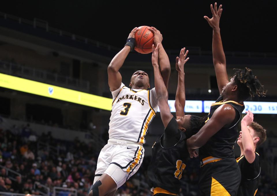 Quaker Valley's Adou Thiero (3) goes up for a layup against Montour during the first half of the WPIAL 4A championship game on March 3 at the Petersen Events Center in Pittsburgh. Quaker Valley won the title.