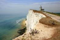 <p>After almost two centuries of petitioning for a lighthouse along this particularly perilous stretch of coastline, <a href="https://www.belletout.co.uk/" rel="nofollow noopener" target="_blank" data-ylk="slk:Belle Tout;elm:context_link;itc:0;sec:content-canvas" class="link ">Belle Tout</a> was constructed in 1832. By 1902, however, it had been decommissioned, and a new lighthouse was built at the base of the cliffs. Between 1902 and 2008, the lighthouse passed into different ownerships, used as target shelling practice during WWII by Canadian troops, and moved back 17 metres due to the impending threat of erosion. </p><p>The product of careful renovations, Belle Tout opened in 2010 as a bed and breakfast. Its rooms are playfully themed according to the building’s nautical heritage: The Captain’s Cabin, Old England and Keeper’s Loft.</p><p>The <a href="https://www.vintageinn.co.uk/restaurants/south-east/thebeachyheadeastbourne" rel="nofollow noopener" target="_blank" data-ylk="slk:Beachy Head Pub;elm:context_link;itc:0;sec:content-canvas" class="link ">Beachy Head Pub</a> and the <a href="http://www.ploughandharrowlitlington.co.uk/" rel="nofollow noopener" target="_blank" data-ylk="slk:Plough and Harrow;elm:context_link;itc:0;sec:content-canvas" class="link ">Plough and Harrow</a> are two excellent local pubs at which to while away your afternoons or to soak up the evening’s excesses. Visitors tend to explore the area either on foot (try the <a href="https://www.beachyhead.org.uk/app/uploads/2017/07/Beachy_Head_Walk.pdf" rel="nofollow noopener" target="_blank" data-ylk="slk:Beachy Head walk;elm:context_link;itc:0;sec:content-canvas" class="link ">Beachy Head walk</a>) or by bike (visit the nearby <a href="https://www.app-bike.co.uk/" rel="nofollow noopener" target="_blank" data-ylk="slk:bike rental and sharing station;elm:context_link;itc:0;sec:content-canvas" class="link ">bike rental and sharing station</a>).</p>