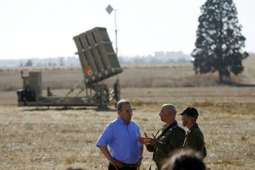 Israeli Defense Minister Ehud Barak (left) visits an Iron Dome launcher stationed close to Ashkelon. Gaza's Popular Resistance Committees agreed to halt to rocket fire on Israel and abide by an Egyptian-brokered truce after four days of deadly clashes