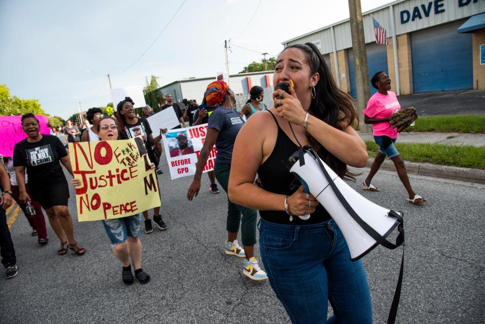 Daniel Chanzes, a local activist, leads the crowd in chants and organizing during a protest for Terrell Bradley in Gainesville, Fla., on Sunday, July 17, 2022.