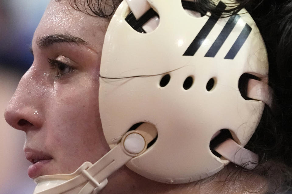 North Central women's wrestling team's Amani Jones takes a break during a practice at North Central College in Naperville, Ill., Monday, March 4, 2024. The team is a national powerhouse even though the program is only a few years old and the school is D-III. (AP Photo/Nam Y. Huh)