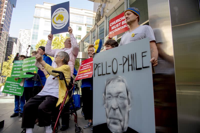 Protesters stand outside the County Court of Victoria on Wednesday. Source: AAP