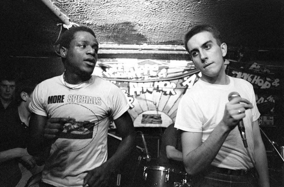 Terry Hall, right, and Neville Staple performing with the Specials in London, 1980.