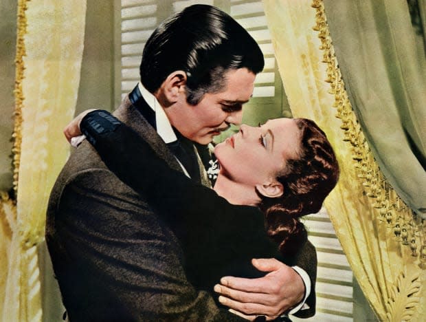 Rhett Butler (Clark Gable) embraces Scarlett O'Hara (Vivien Leigh) in a famous scene from the 1939 epic film "Gone with the Wind."<p><a href="https://www.gettyimages.com/detail/517201466" rel="nofollow noopener" target="_blank" data-ylk="slk:Bettmann/Getty Images;elm:context_link;itc:0;sec:content-canvas" class="link ">Bettmann/Getty Images</a></p>