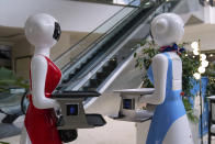 Robotic waiters stand at the Robot Cafe in Nairobi, Kenya Thursday, Aug. 29, 2024. The three robots, christened Claire, R24 and Nadia, are not programmed to have a full conversation with customers, but they can say "Your order is ready, Welcome" then people have to press an exit button after picking up their food from the tray. (AP Photo/Brian Inganga)