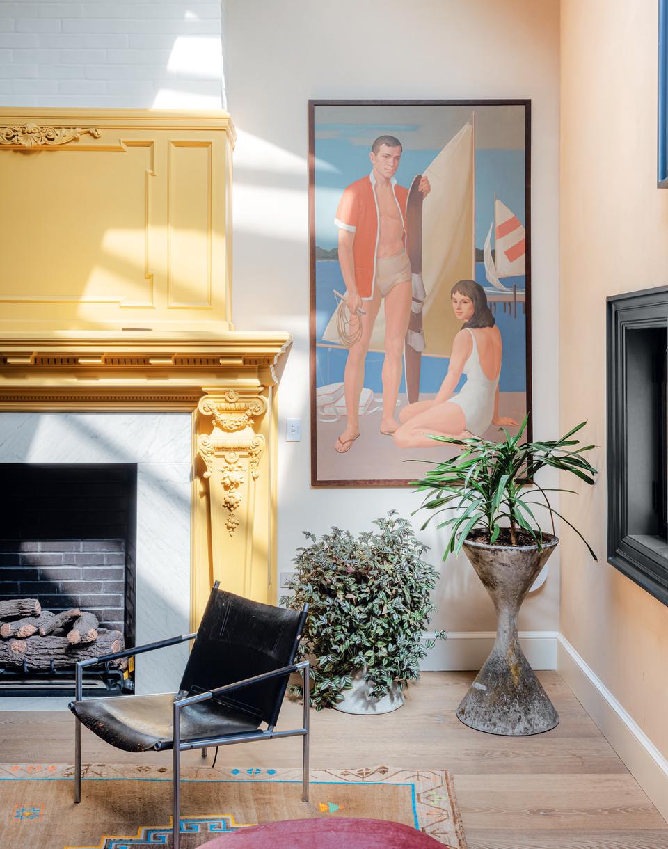 A living room with a painted fireplace