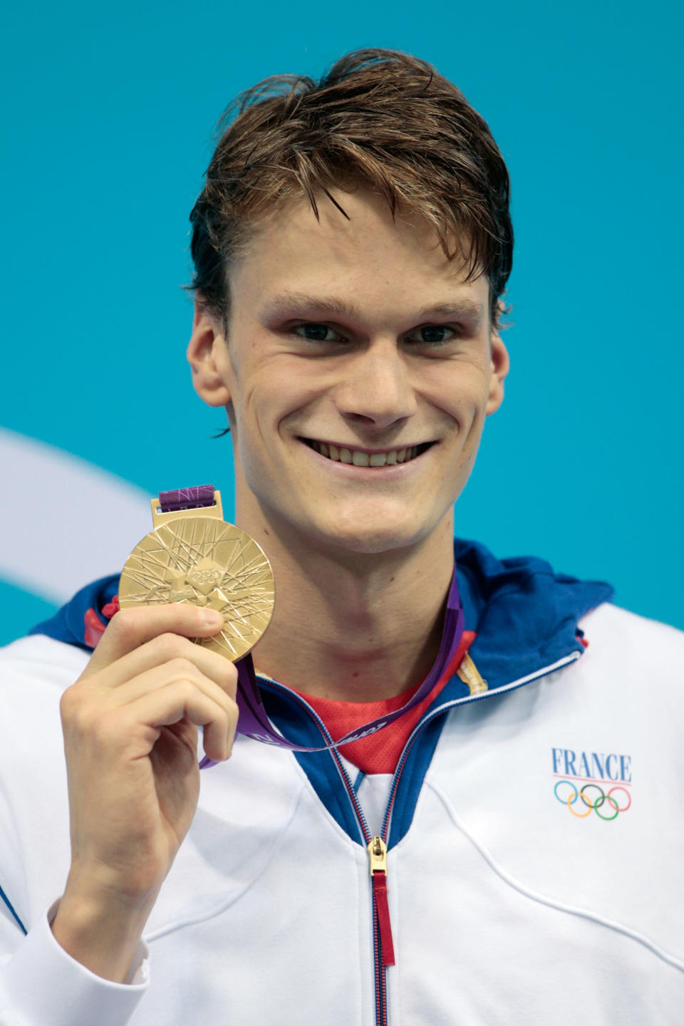 LONDON, ENGLAND - JULY 30: Gold medalist Yannick Agnel of France celebrates with his medal during the medal cermony for the Men's 200m Freestyle on Day 3 of the London 2012 Olympic Games at the Aquatics Centre on July 30, 2012 in London, England. (Photo by Adam Pretty/Getty Images)