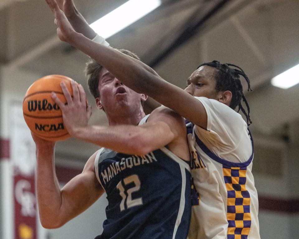 Manasquan's Griffin Linstra shoots with a Camden defender on him during the NJSIAA Group 2 Semifinals on March 5, 2024.