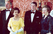 FILE - The June 10, 1984 file photo shows Queen Elizabeth II, second left, standing with, West German Chancellor Helmut Kohl, left, U.S. President Ronald Reagan, second right, and Britain's Prime Minister Margaret Thatcher at London's Buckingham Palace, prior to a dinner for summit leaders. (AP Photo, File)