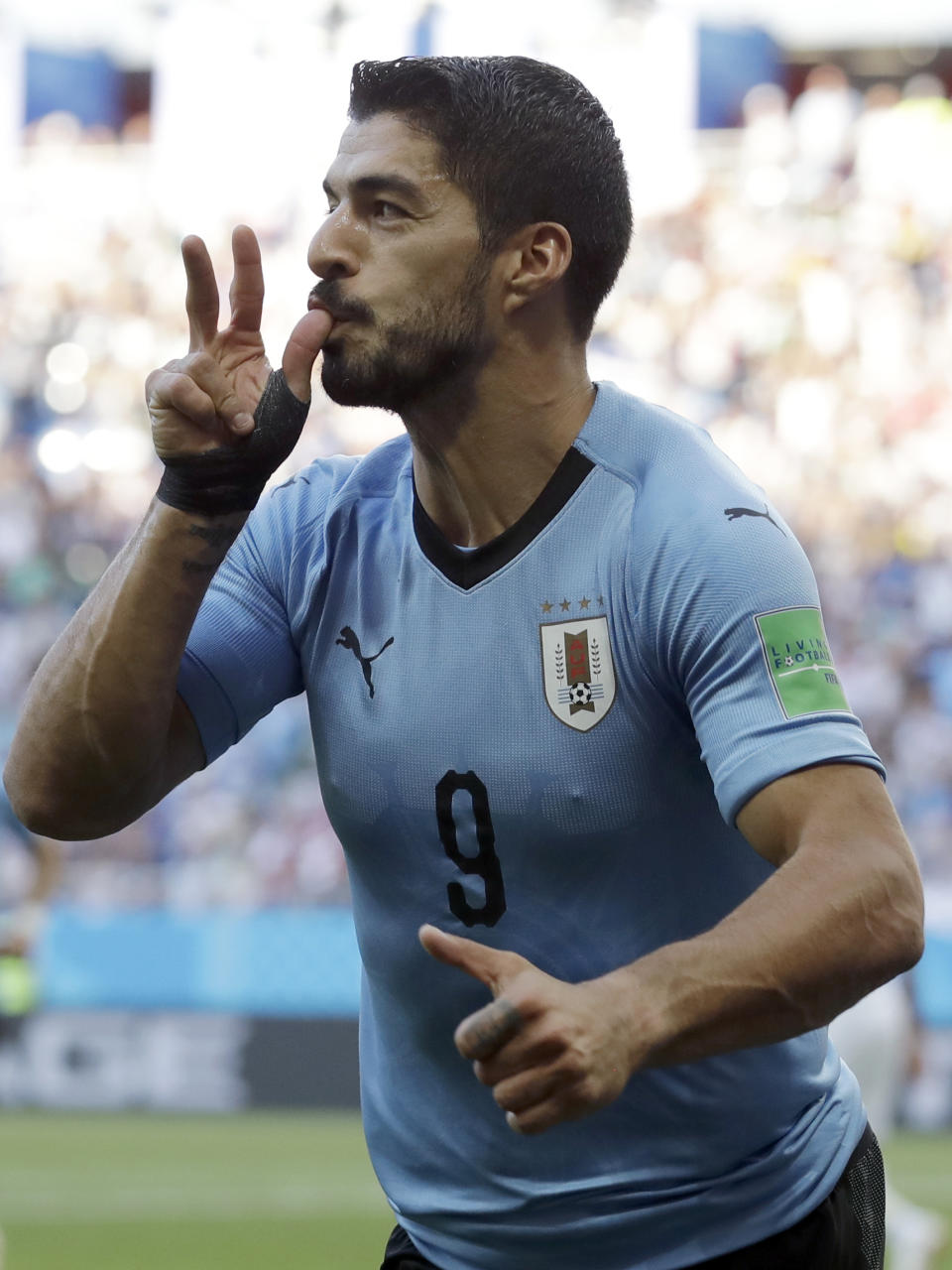 <p>Luis Suarez celebrates scoring his first goal </p>