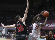 Virginia Tech's Tyrece Radford (23) shoots past VMI's Sean Conway (30) during the first half of an NCAA college basketball game in Blacksburg, Va., Thursday, Dec. 3 2020. (Matt Gentry/The Roanoke Times via AP, Pool)