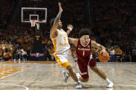 Alabama guard Mark Sears (1) drives as he's defended by Tennessee guard Zakai Zeigler (5) during the second half of an NCAA college basketball game Saturday, Jan. 20, 2024, in Knoxville, Tenn. (AP Photo/Wade Payne)