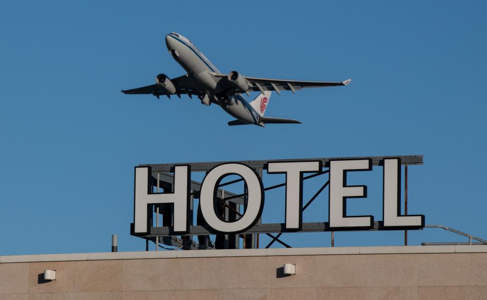 An airplane passes over a Sofitel hotel as it takes off from a runway at Heathrow AirportGetty Images