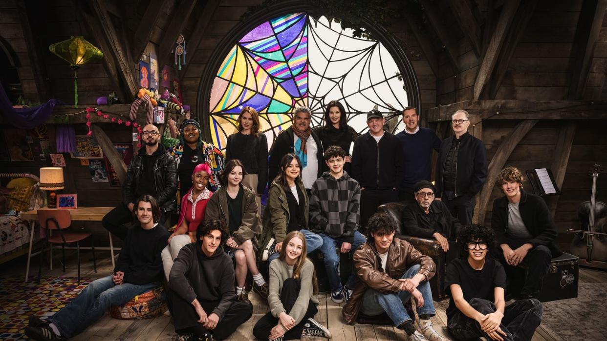 wednesday l to r georgie farmer, victor dorobantu, luyanda unati lewis nayo, joy sunday, owen painter, emma myers, billie piper, jenna ortega, evie templeton, luis guzmaacute n, isaac ordonez, catherine zeta jones, alfred gough, noah taylor, miles millar, tim burton, steve buscemi, moosa mostafa, hunter doohan on the set of wednesday season 2 cr helen sloannetflixcopy 2024