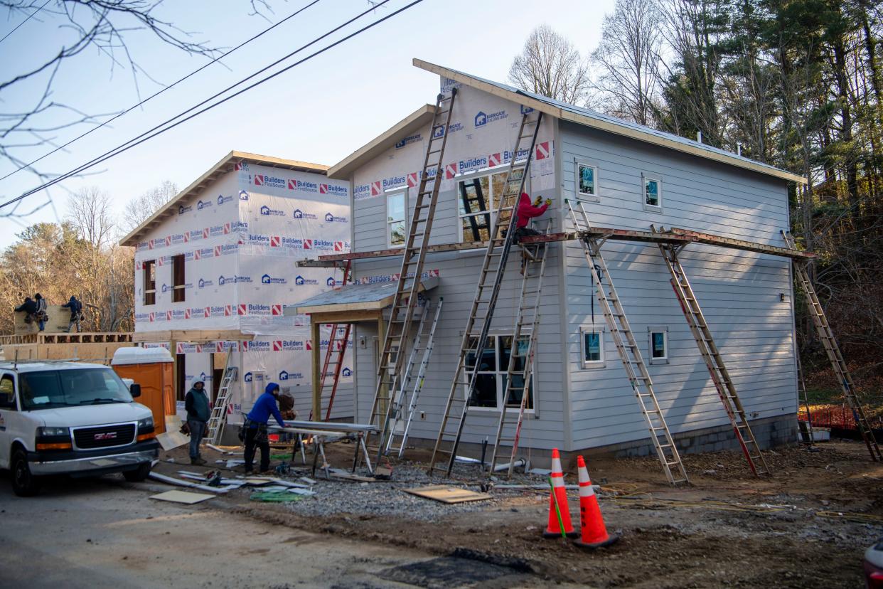 Homes under construction on Cub Road in West Asheville, Dec. 11, 2023.