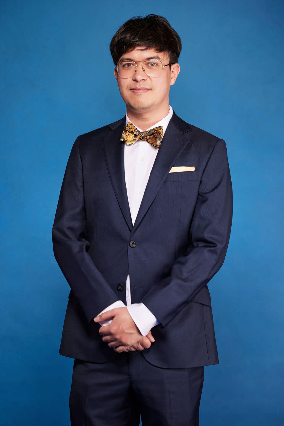 phil wang wearing a suit during a portrait for national comedy awards for stand up to cancer