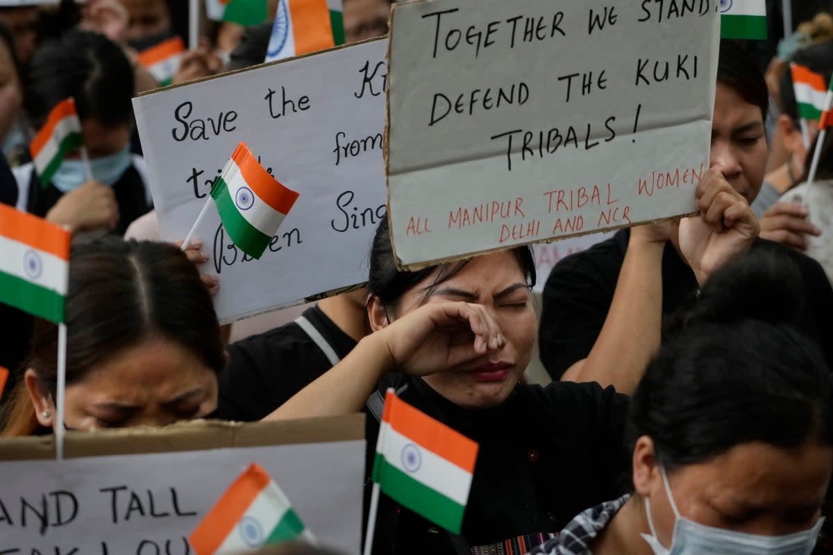 A member of the Kuki tribe cries during a sit in protest against the killing of tribals in their northeastern home state of Manipur (Copyright 2023 The Associated Press. All rights reserved.)