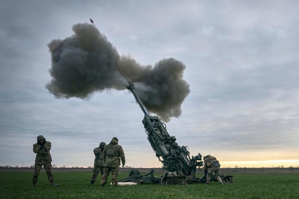 Ukrainian soldiers fire at Russian positions from a US-supplied M777 howitzer