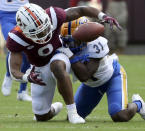 Virginia Tech wide receiver Tayvion Robinson (9) drops a pass while defended by Pittsburgh's Erick Hallett II (31) in the first half of an NCAA college football game, Saturday, Oct. 16 2021, in Blacksburg, Va. (Matt Gentry/The Roanoke Times via AP)