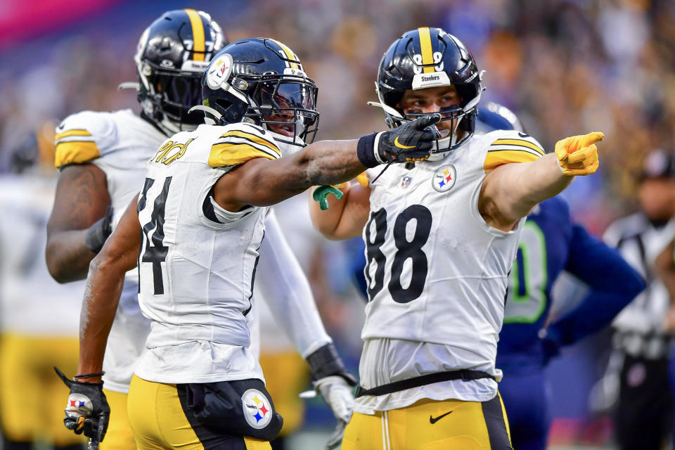 SEATTLE, WASHINGTON – DECEMBER 31: George Pickens #14 celebrates a first down with Pat Freiermuth #88 of the Pittsburgh Steelers during the fourth quarter of a game against the Seattle Seahawks at Lumen Field on December 31, 2023 in Seattle, Washington. (Photo by Jane Gershovich/Getty Images)