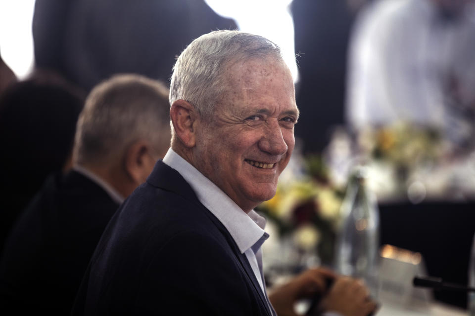 Israeli Defense Minister Gantz smiles before the weekly cabinet meeting in Kibbutz Mevo Hama, in the Israeli-occupied Golan Heights, Sunday, Dec. 26, 2021. Israeli Prime Minister Naftali Bennett said Sunday the country intends to double the amount of settlers living in the Israeli-controlled Golan Heights with a multimillion-dollar plan meant to further consolidate Israel’s hold on the territory it captured from Syria more than five decades ago. (Nir Elias/Pool via AP)