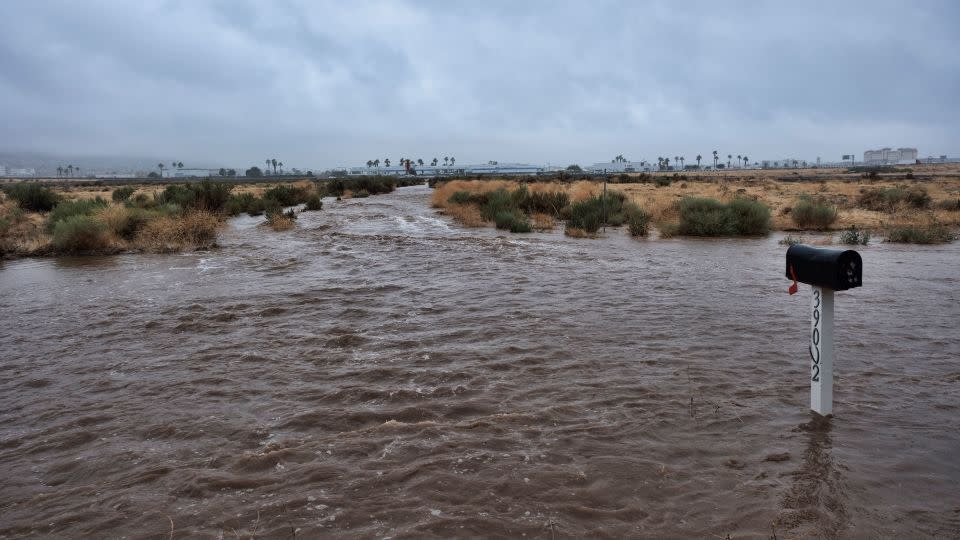 A mailbox stands on a flooded residential street in Palmdale, California, as the storm moves into the area, Sunday, August 20, 2023.  - Richard Vogel/AP