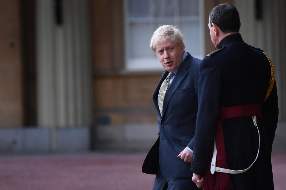 Prime Minister Boris Johnson (left), with Queen's Equerry-in-Waiting Lieutenant Colonel Charles Richards, leaves Buckingham Palace in London after meeting Queen Elizabeth II and accepting her invitation to form a new government after the Conservative Party was returned to power in the General Election with an increased majority.