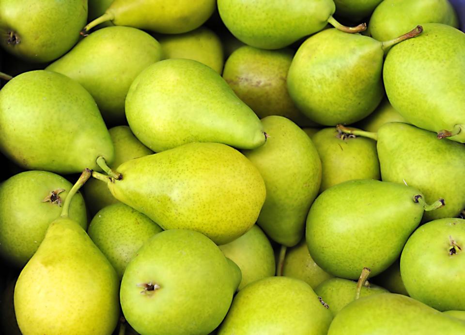 Pile of ripe fresh green pears