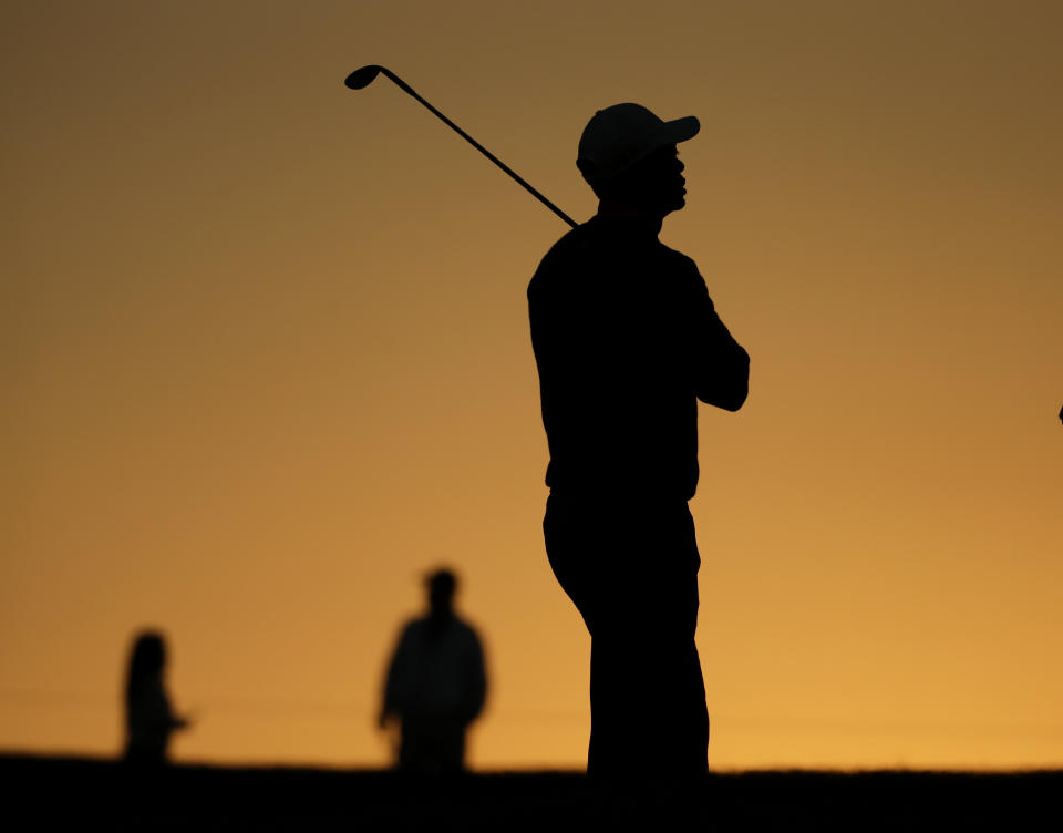 Tiger Woods waits to hit on the second hole during the pro-am at the Farmers Insurance Open golf tournament at Torrey Pines Golf Course on Wednesday, Jan. 22, 2014, in San Diego. (AP Photo/Chris Carlson)