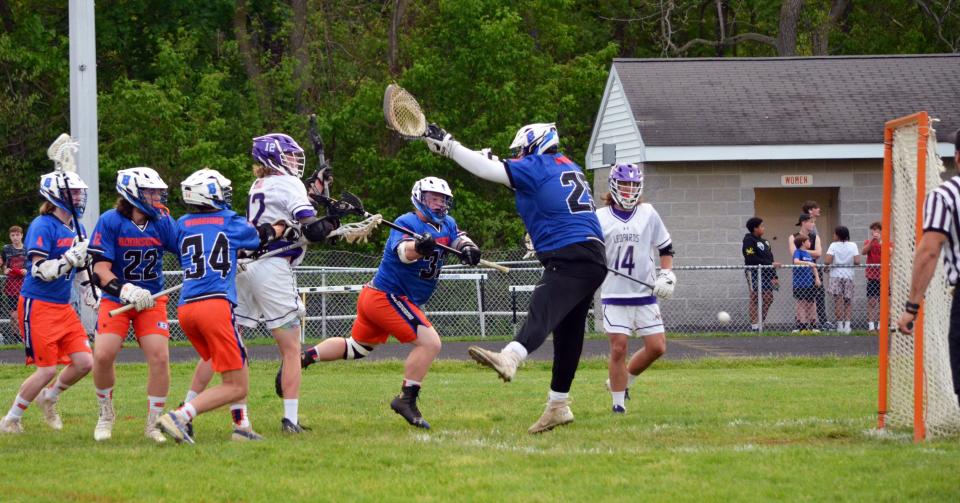 Smithsburg's Alex Scholl fires a shot past Boonboro goalie Jacob Wells for one of his five goals in the Leopards' 23-4 playoff victory.