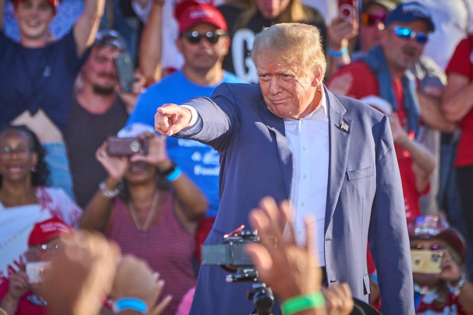 Former President Donald Trump takes the stage to deliver remarks during his rally at Legacy Sports Park in Mesa on Sunday, Oct. 9, 2022.