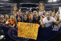 Florida fans cheer before an NCAA Final Four tournament college basketball semifinal game against Connecticut, Saturday, April 5, 2014, in Arlington, Texas. (AP Photo/David J. Phillip)