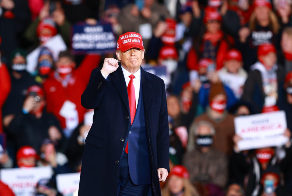 US President Donald Trump gestures during a campaign rally in Michigan. 