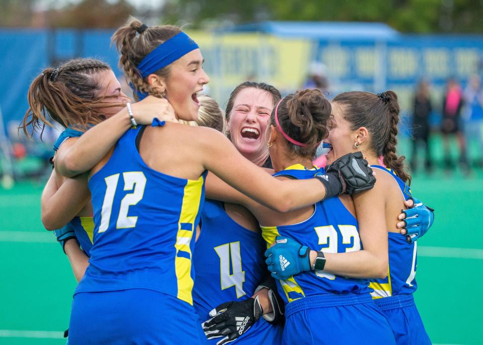 Delaware field hockey players celebrate their CAA title.