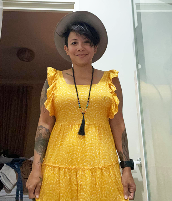 Mum wears Kmart yellow kids dress as adult side-boob dress