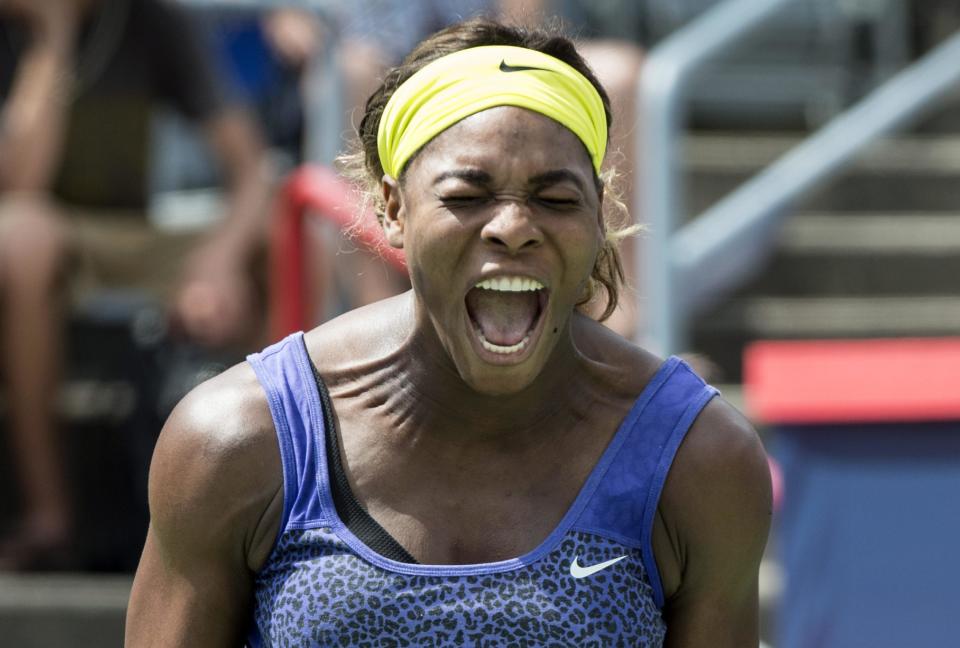 Serena Williams yells out after losing a point to her sister Venus at the Rogers Cup tennis tournament Saturday Aug. 9, 2014 in Montreal. (AP Photo/The Canadian Press, Paul Chiasson)