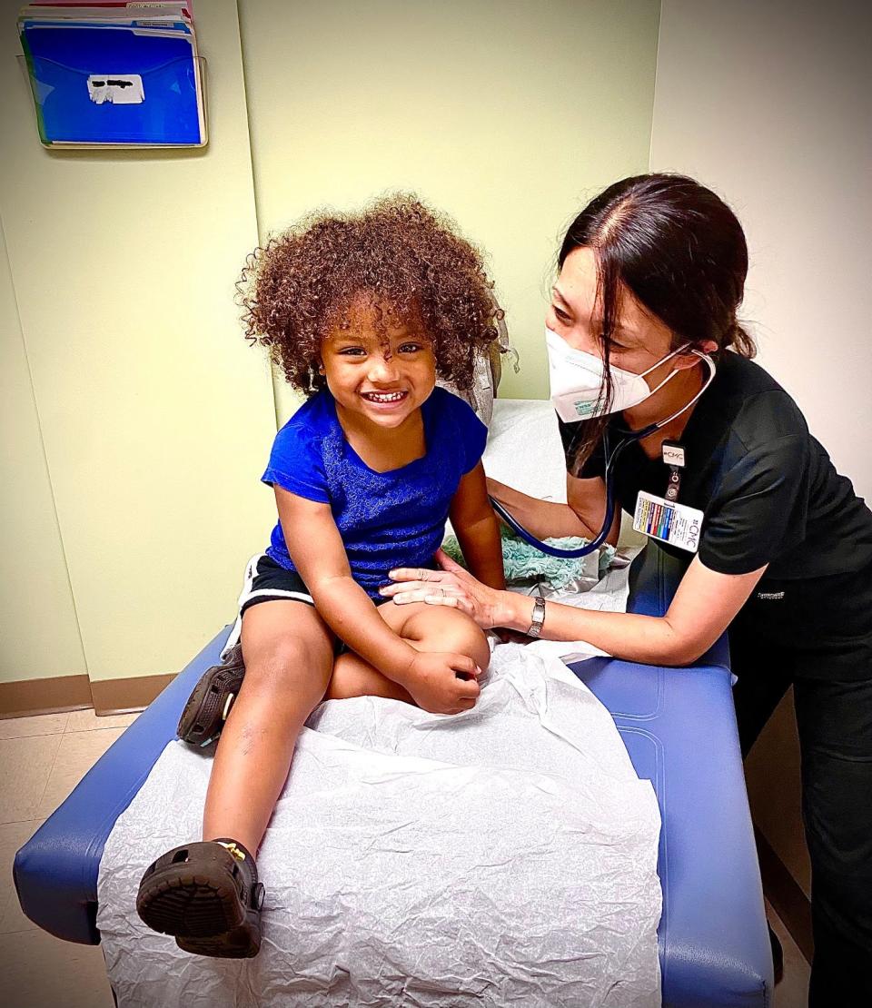 Dr. Reiko Johnson and one of her young patients.