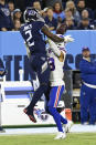 Tennessee Titans wide receiver Julio Jones (2) makes a catch over Buffalo Bills strong safety Micah Hyde (23) in the first half of an NFL football game Monday, Oct. 18, 2021, in Nashville, Tenn. (AP Photo/Mark Zaleski)