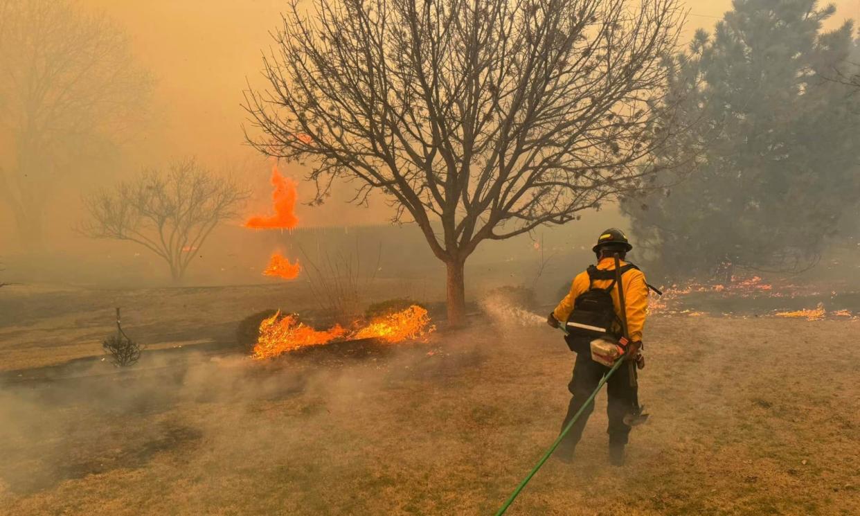 <span>A firefighter battling the Smokehouse Creek Fire, near Amarillo, in the Texas Panhandle, on Wednesday.</span><span>Photograph: Flower Mound Fire Department/AFP/Getty Images</span>