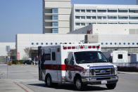 An ambulance leaves Harbor-UCLA Medical Center Wednesday, Feb. 24, 2021, in Torrance, Calif. Golfer Tiger Woods was hospitalized and underwent surgery at the hospital following a car accident on Tuesday. (AP Photo/Ashley Landis)